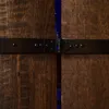 A close-up view of a wooden cabinet with a black metal hinge and strap. Produktbild-Vorschau