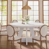 A round dining table with chairs in a well-lit room with large windows. Náhľad obrázku produktu