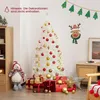 A white Christmas tree decorated with red and gold ornaments, surrounded by gift boxes and a plush toy. Produktbild-Vorschau