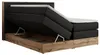 A king-size boxspring bed with its storage compartment open, revealing the internal mechanism and wooden frame. Produktbild-Vorschau
