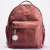 A brown leather backpack with a small clock attached to the front pocket. Produktbild-Vorschau