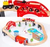 A collage of two images showing a wooden train set with tracks, bridges, a train, and accessories. Produktbild-Vorschau