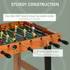 A close-up view of a foosball table, highlighting its construction and features. Voir les images du produit