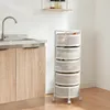 A white rolling cart with five mesh baskets filled with produce, placed next to a kitchen counter with a sink. Voir les images du produit