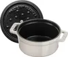 A white Staub mini cocotte pot and its black lid are shown against a white background. Podgląd zdjęcia produktu