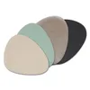 Four oval placemats in different colors are layered on a white background. Anteprima dell’immagine prodotto