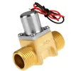 A close-up studio shot of a brass solenoid valve with electrical wires. Produktbild-Vorschau