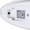 A close-up view of the bottom of a white handheld vacuum cleaner, showing a charging port and a label with product information. Podgląd zdjęcia produktu