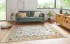 A living room scene with a sofa, rug, and side table. Podgląd zdjęcia produktu