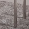 Close-up of two metal table legs on a textured gray carpet. Náhľad obrázku produktu