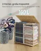 A laundry basket filled with clothes next to a storage unit with folded clothes. Produktbild-Vorschau