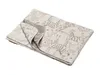 A folded blanket with a safari animal print. Produktbild-Vorschau