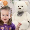 Duży miś pluszowy 140 cm, beżowy, miękka maskotka z kokardą Podgląd zdjęcia produktu 6