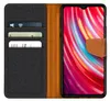 A flip case wallet for a smartphone, showing the inside compartments and the phone screen. Anteprima dell’immagine prodotto