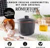 A Römertopf garlic keeper with garlic, herbs, and olive oil. Produktbild-Vorschau