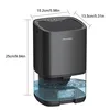 A black dehumidifier with a transparent water tank is shown with dimensions indicated by lines and text. Náhled obrázku produktu