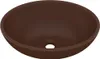 A brown oval ceramic sink with a drain hole. Náhled obrázku produktu