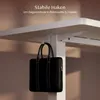 A black briefcase is hanging from a white hook attached to the underside of a white desk. Anteprima dell’immagine prodotto