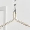 Close-up of a rope knot and metal chain used for hanging a chair. Produktbild-Vorschau