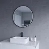 A modern bathroom vanity with a square sink, black faucet, and a round illuminated mirror above it. Produktbild-Vorschau
