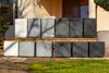 Several planters are displayed in front of a building entrance. Produktbild-Vorschau
