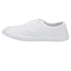 A side view of a white canvas sneaker. Produktbild-Vorschau