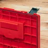 A close-up view of the inside of a red tool case with a green latch. Anteprima dell’immagine prodotto