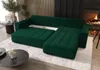 A modern living room with a green sectional sofa, a fireplace, and coffee tables. Voir les images du produit