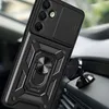 A black phone case with a ring holder and camera cover is shown attached to a magnetic car mount, placed on a car's dashboard. Anteprima dell’immagine prodotto