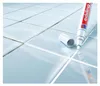 A marker is being used to touch up the grout lines between tiles. Produktbild-Vorschau