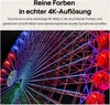 A close-up of a Ferris wheel at night, illuminated with colorful lights, with marketing text above. Voir les images du produit
