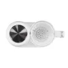 A top-down view of a white baby food maker with a silver lid on one compartment and a clear plastic compartment with holes on the other. Produktbild-Vorschau