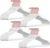 A pile of white velvet hangers with rose gold hooks. Produktbild-Vorschau