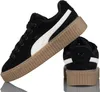 A pair of black Puma Creeper Phatty sneakers with white accents and a gum sole, shown against a white background. Anteprima dell’immagine prodotto