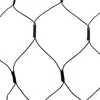 A close-up view of a black net with diamond-shaped openings, against a white background. Produktbild-Vorschau