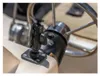 A black mounting bracket is attached to a boat console near a steering wheel. Anteprima dell’immagine prodotto