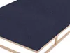 A close-up view of a mattress topper or fitted sheet on a bed frame. Produktbild-Vorschau