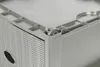 A close-up view of the corner of a gray plastic drawer tower with a wicker-like texture, showing a small wheel attached to the base. Produktbild-Vorschau