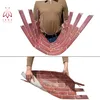 A person is holding up a flexible panel designed to look like a brick wall. Produktbild-Vorschau
