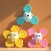 Three colorful baby spinners with animal faces are arranged on a surface. Podgląd zdjęcia produktu
