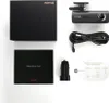 A flat lay of a dash cam and its accessories, including the box, manual, car charger, and cables, arranged on a white background. Voir les images du produit