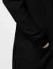 A close-up view of a dark grey knitted cardigan, showing the sleeve and a pocket. Produktbild-Vorschau
