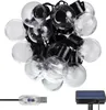 A string of globe lights with a USB connector and a solar panel. Náhľad obrázku produktu