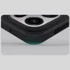 A close-up view of the corner of a black smartphone case, highlighting the camera module and a subtle green glow at the bottom edge. Produktbild-Vorschau