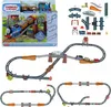 A collage of images showing a Thomas & Friends train set, including packaging, individual track pieces, and assembled track configurations with trains. Náhled obrázku produktu