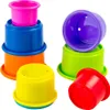A collection of colorful stacking cups arranged in two groups against a white background. Produktbild-Vorschau