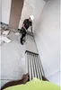 A construction worker is using a telescopic plank in a room under construction. Produktbild-Vorschau