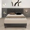A modern bedroom setting with a bed as the central focus. Náhled obrázku produktu