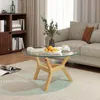 A living room scene with a coffee table in the foreground, a sofa and bookshelf in the background. Anteprima dell’immagine prodotto