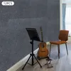 Acoustic panels on a wall with a guitar, music stand, and chair. Podgląd zdjęcia produktu